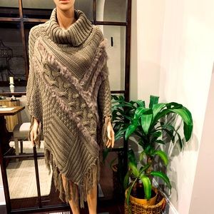 Cozy cable knit poncho with cowl neck and fur trim